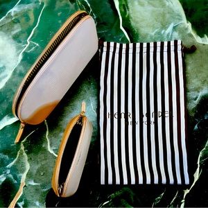 Pair of Henri Bendel leather clutches.